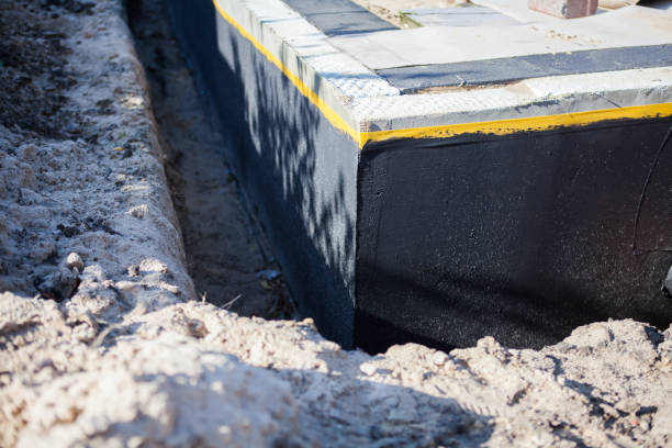 Professional Waterproofing technician working in Carthage, IN